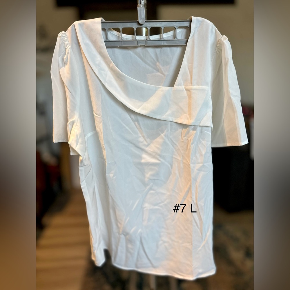 White size L top new no tags never worn.